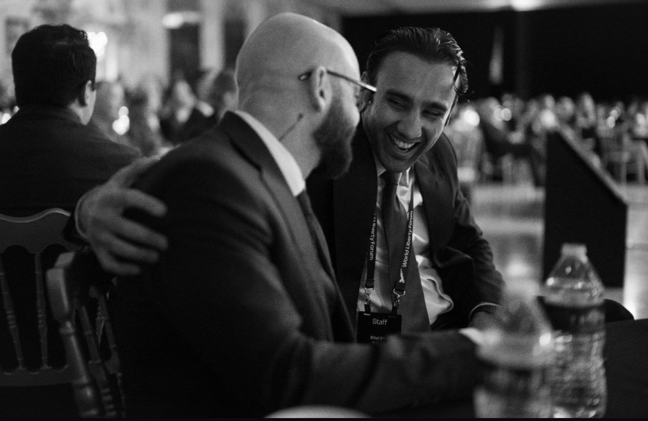 Matthew in conversation with a colleague at a professional gathering
